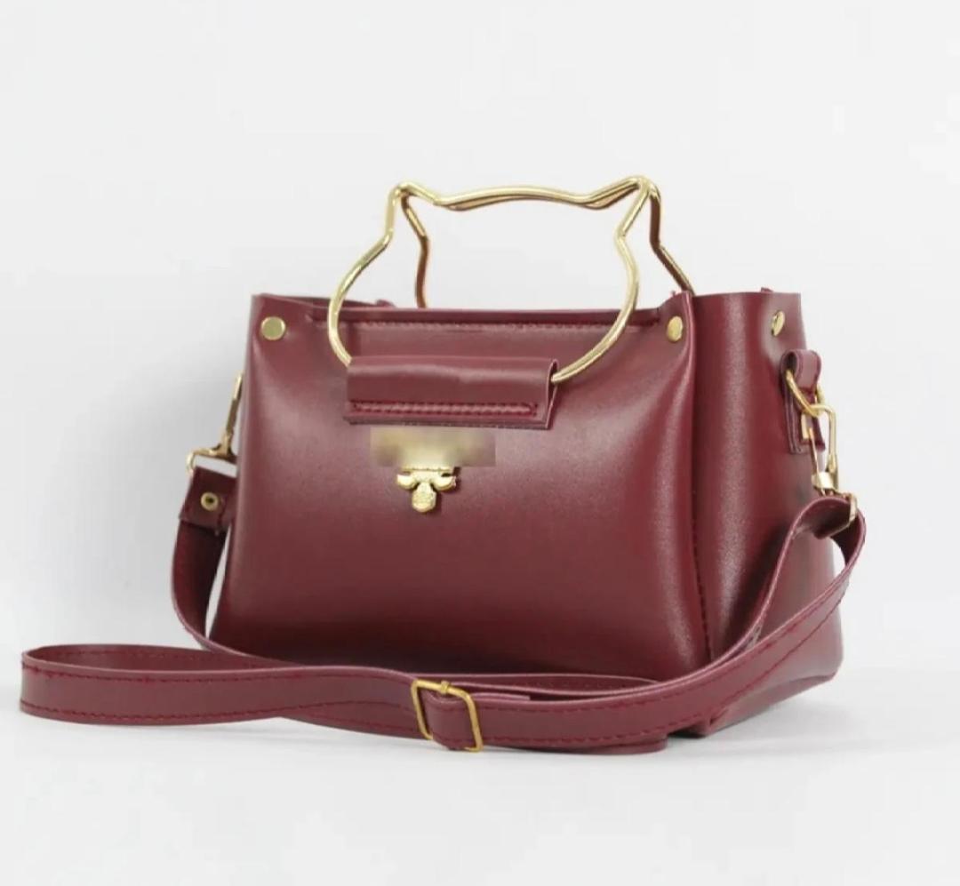 Side view showing top handle design of Women PU Leather Hand Bag Maroon